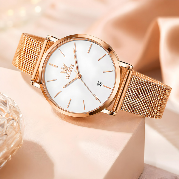 Montre femme Rose Gold Perle avec cadran blanc épuré et bracelet maille milanaise rose gold.